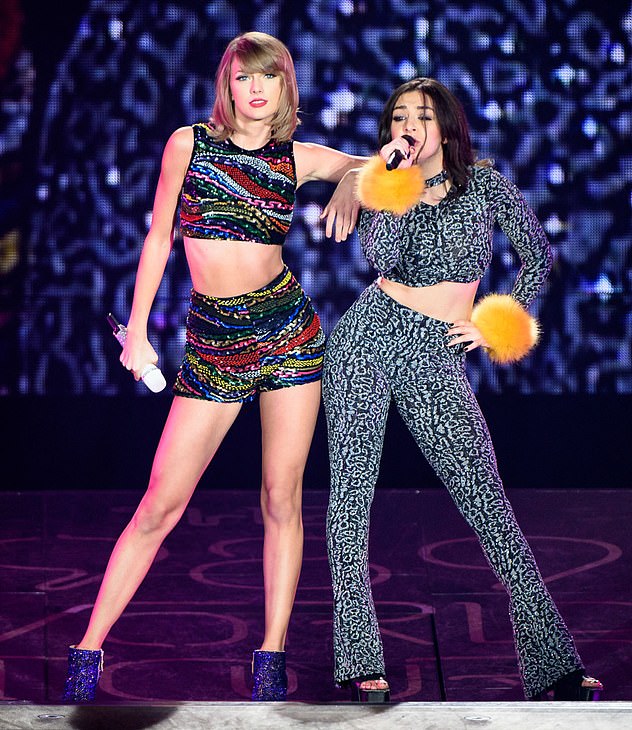 Fans have long speculated that Charli and Taylor have a bad relationship, with the two singers' recent albums competing on the charts (pictured, performing together in 2015).