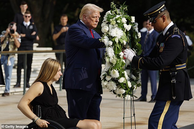 Donald Trump lays a wreath next to retired Marine Corporal Kelsee Lainhart, who was injured in the Abbey Gate attack