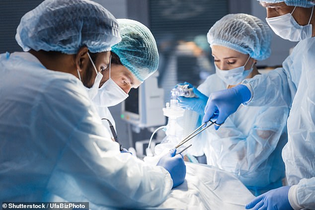 File photo of a surgical team operating on a patient. The new wafer is expected to provide around-the-clock relief for up to a month after the procedure.