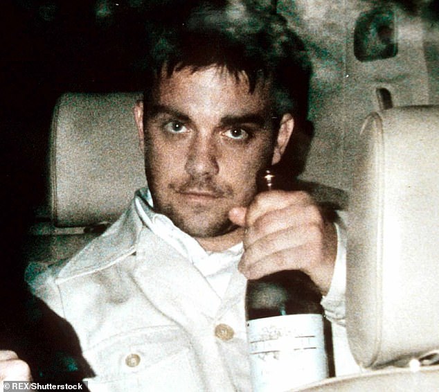 The TV presenter and former music publicist worked with Take That during the height of the band's fame in the 1990s and Robbie's battle with addiction (Robbie pictured in 1997)