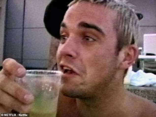 Robbie previously admitted that when he was on tour with Take That he would drink a bottle of vodka the day before rehearsals and was given an injection by a doctor after a six-day drinking binge (pictured, 1996).