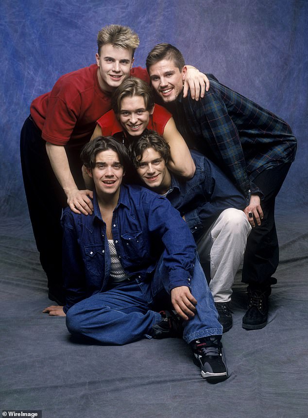 He confessed: 'I did the show and then came back out and carried on as if nothing had happened' (pictured with Gary Barlow, Mark Owen, Jason Orange and Howard Donald)