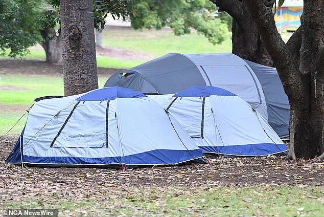 Many homeless people have no choice but to pitch a tent in a public space, which can be dangerous (pictured: tents for homeless people in Brisbane)