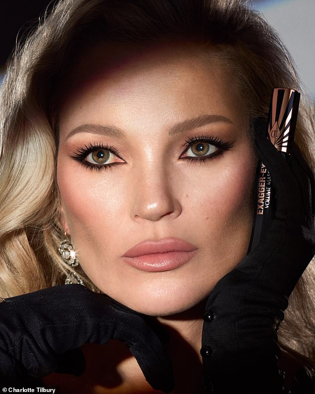 The supermodel, who turned 50 in January, wore bold black eyeliner as she looked in the mirror.