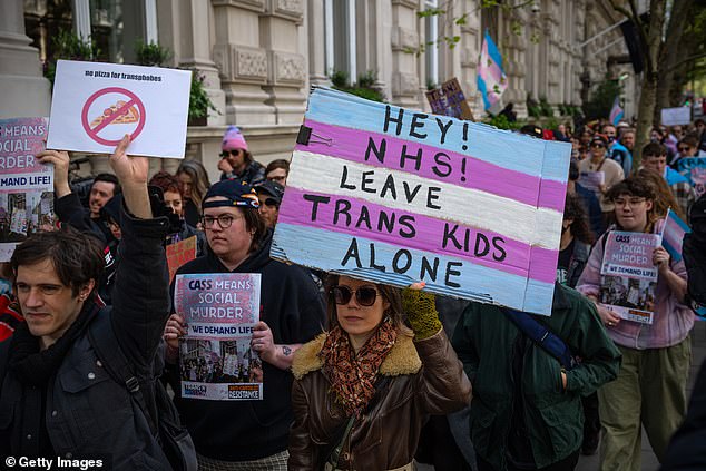 After Dr Hilary Cass presented her report on NHS gender identity services for children and young people, many treatments were suspended and campaigners protested the ban. Pictured, a protest in London on 20 April 2024