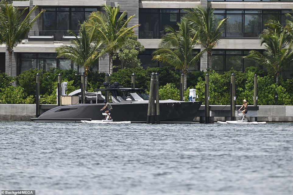 The duo could be seen here paddling alongside a sleek-looking black speedboat that was docked next to a mansion that appears to belong to Gisele's ex, Brady.