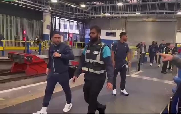 The players were confronted by angry fans as they boarded their train at Euston station.