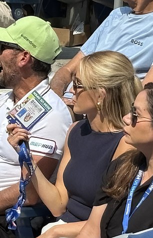 She was previously seen fanning her face with her VIP pass.