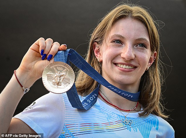 Romanian gymnast Ana Maria Barbosu poses with her Olympic bronze medal