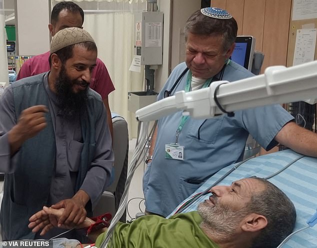 Qaid Farhan Alkadi, an Israeli Bedouin hostage who was kidnapped in the deadly Hamas attack on October 7, is greeted by a loved one after being rescued by Israeli forces at the Soroka Medical Center in Beersheba, Israel.