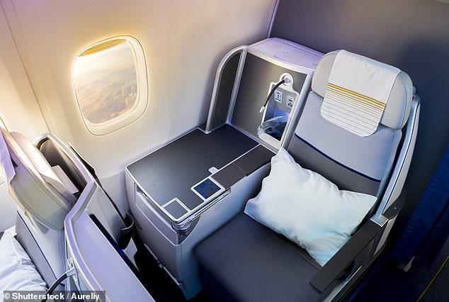 The man was in business class but did not see any entertainment during the entire flight (stock image of a business class seat)