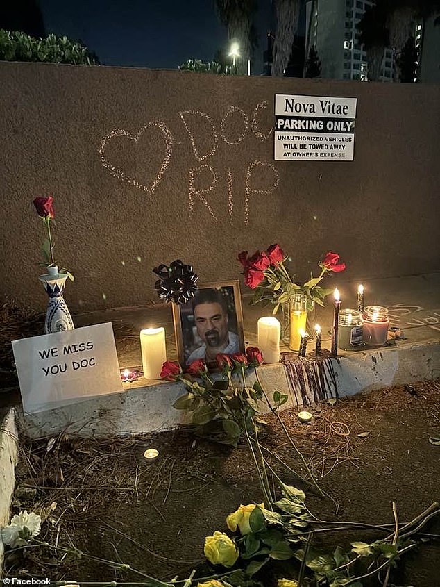 Patients and friends created a memorial outside the clinic with red roses, candles, photos and a sign that read 