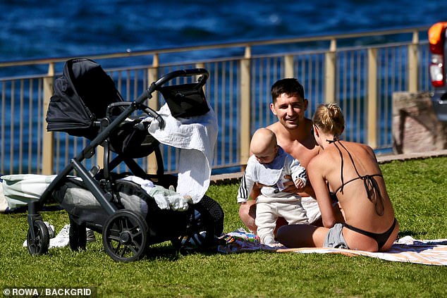 The 26-year-old Roosters player went shirtless and showed off his chiselled physique as he enjoyed the sunny day.