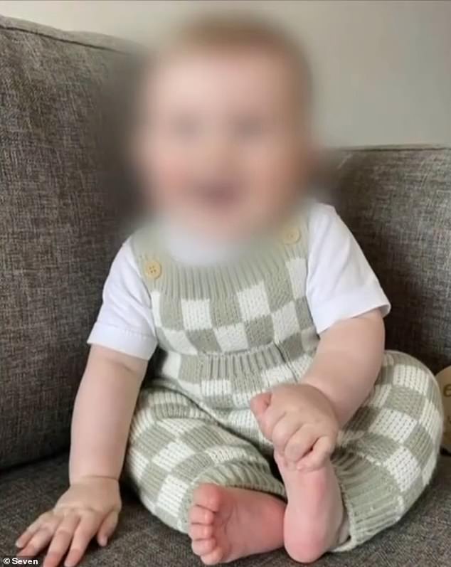 The nine-month-old boy (pictured before the attack) remains in Queensland Children's Hospital.