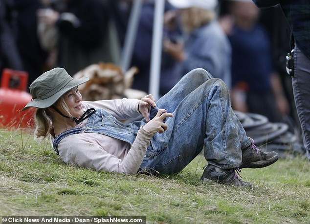 At one point, Bridget was seen covered in mud rolling around on the ground as she took some photos.