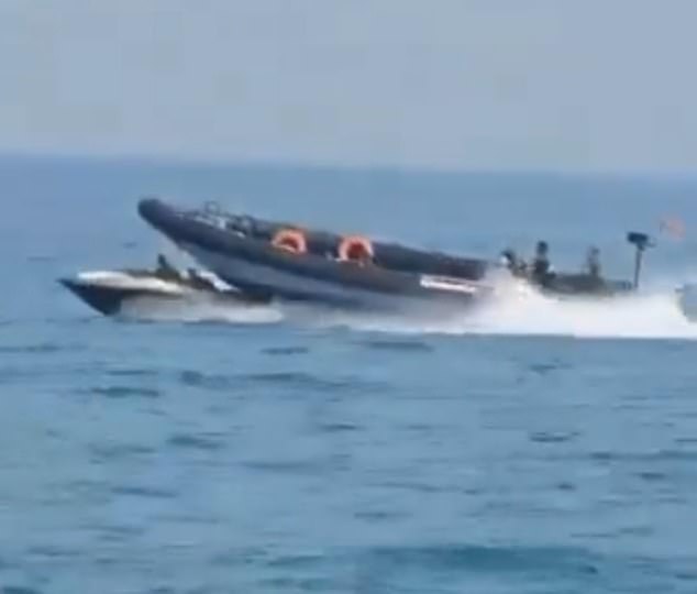 Below you can see the Spanish Civil Guard boat passing over the small motor boat.