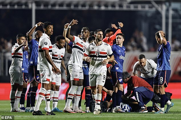 Players are desperately calling for medical attention after Juan Izquierdo collapsed on the pitch last week