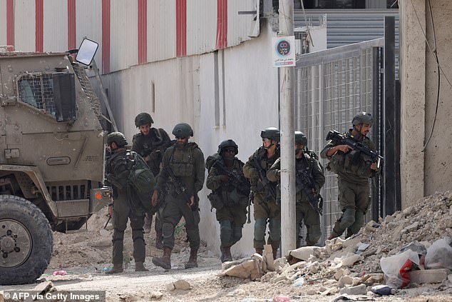 Israeli soldiers operate during a raid at the Nur Shams camp for Palestinian refugees, near the town of Tulkarem in the Israeli-occupied West Bank.