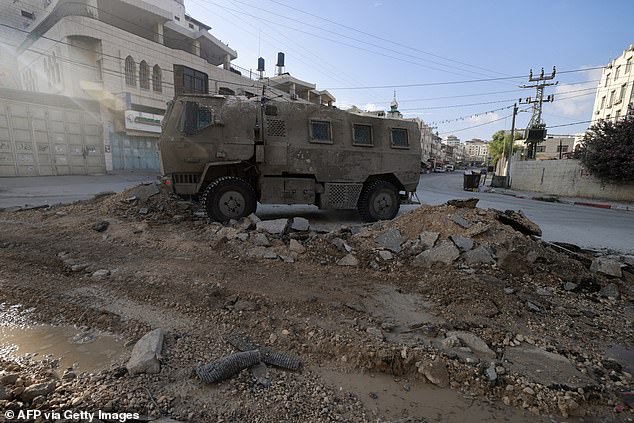 An Israeli military vehicle drives on a road during a raid in the northern town of Tulkarm in the occupied West Bank, on August 28, 2024.