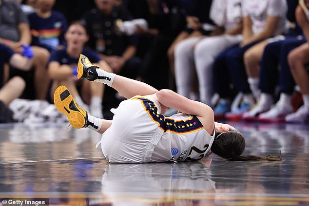 Clark is on the court after the body blow from Connecticut Sun center Thomas