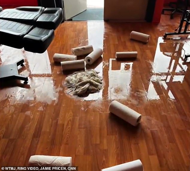 The video also features images of water-soaked sheets on the staircase and rolls of paper towels scattered haphazardly on the floor.