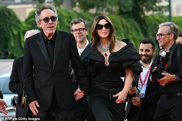 The Italian star showed off her incredible figure in the long dress which featured dramatic puffed sleeves.