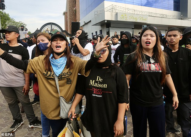 Supporters of religious leader Apolo Quiboloy hold a protest demonstration in front of the building