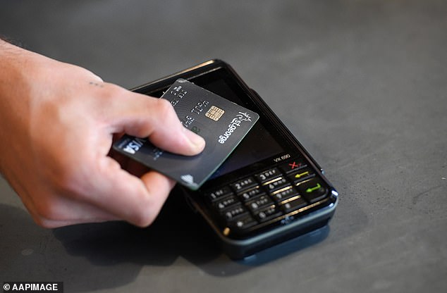 Major telecom companies are charging customers an extra fee to process payments made by cash or cheque instead of paying their bills using electronic payment methods (file image)