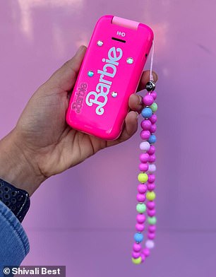 As if that wasn't chic enough, there's also a beaded strap adorned with Barbie phone charms and a selection of sparkly gems and vintage stickers.