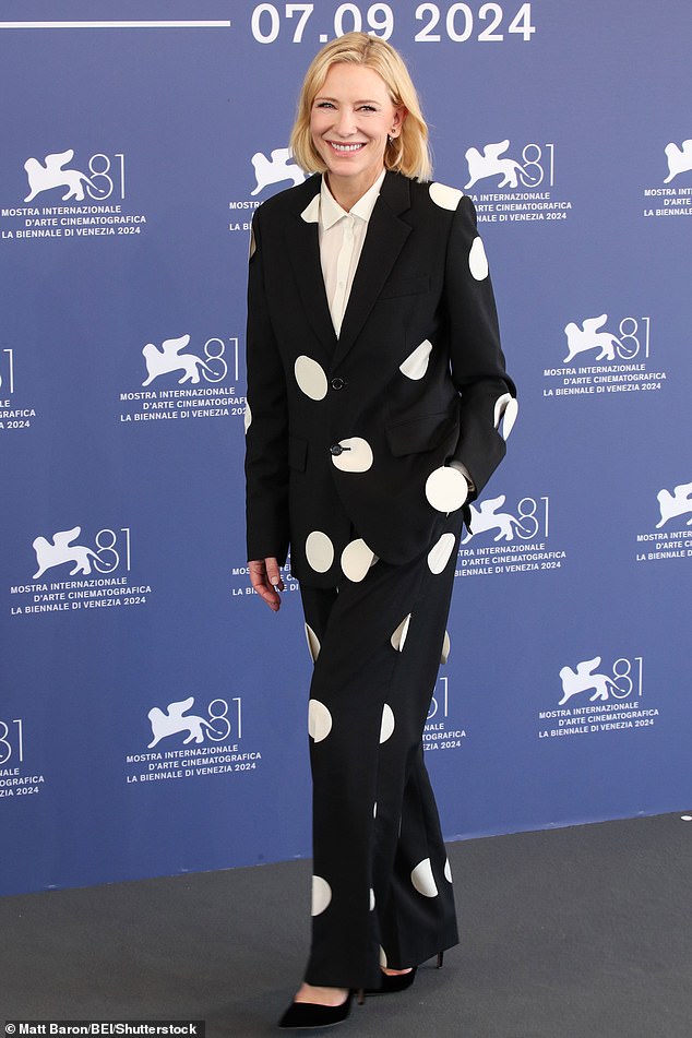 She paired the oversized black and white blazer with a matching pair of wide-leg pants.