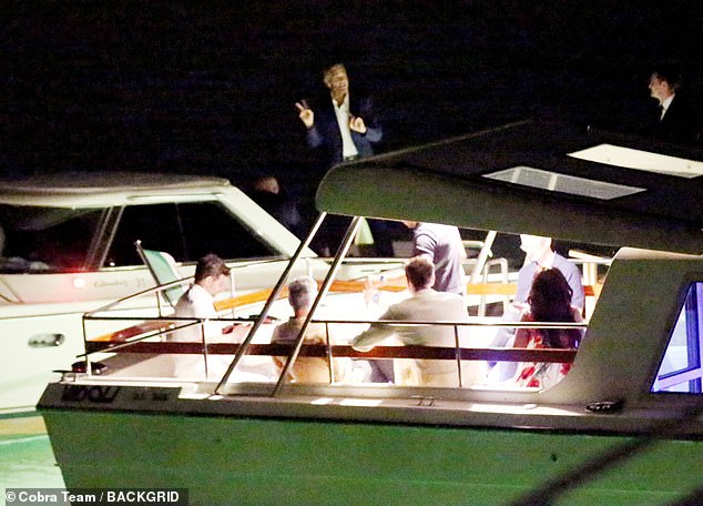 George lingered on the boat, no doubt excited for his movie to hit the big screen.