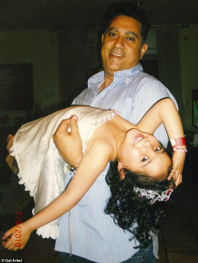 Liri, 6, with her father Eli. The family agreed to release these private photos that show how she grew from a shy child to a confident young woman who dreams of traveling.