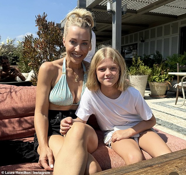 The blonde bombshell showed off her ample cleavage in a pair of black denim shorts as she posed with her daughter Tahlia.