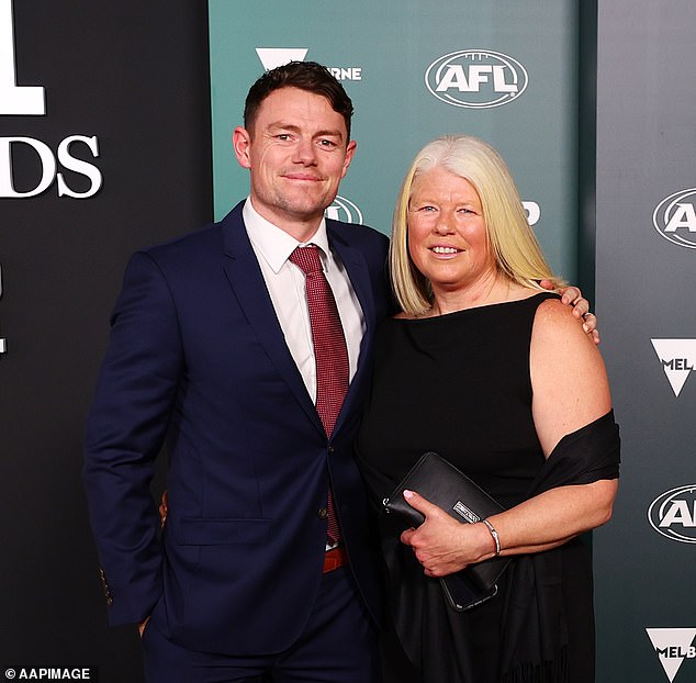 The couple also wore black, with Lachie, who is expecting his second child with wife Jules, opting for a pop of colour with a red tie.