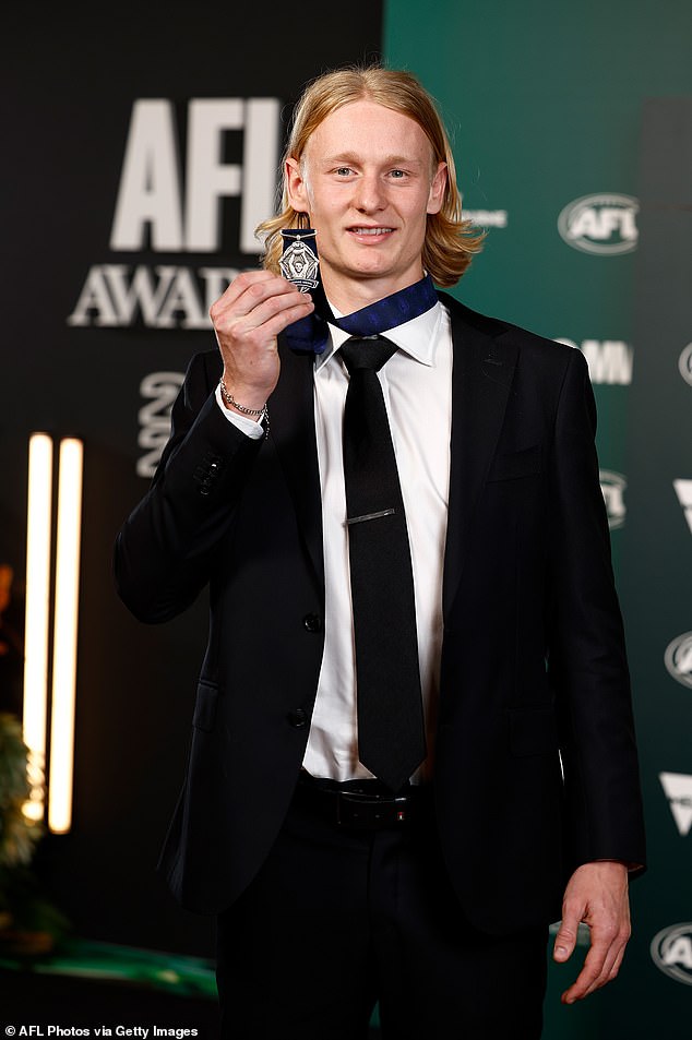 Geelong player Ollie Dempsey, 21, (pictured), earned his own spotlight at the awards ceremony by taking home the AFL Rising Star award.