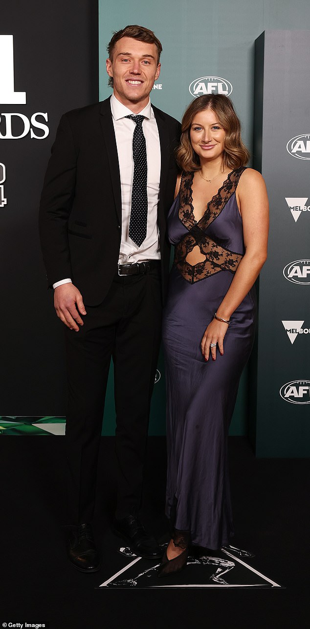 Blues star Patrick Cripps, 29, (left), was all smiles alongside partner Monique Fontana (right), who dazzled in a black satin and lace gown.