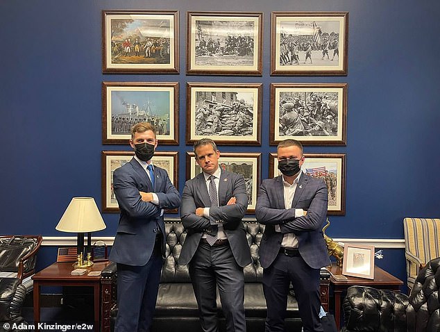 U.S. Air National Guard Lt. Col. and former Congressman Adam Kinzinger, center, with Ukrainian Lt. Col. Oleksii Mes, 31, right