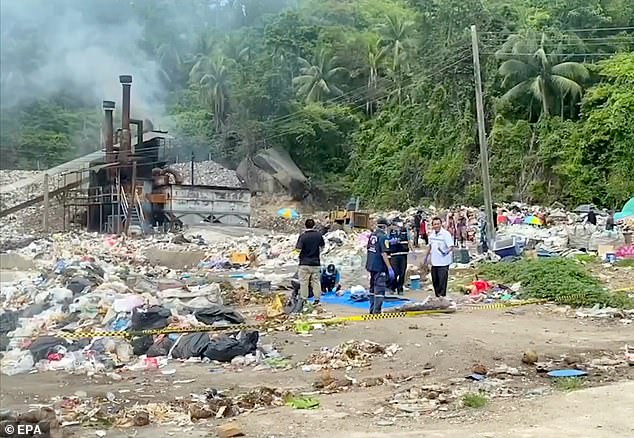 Police officers stand behind a cordon at a garbage dump where Arrieta's body was found.