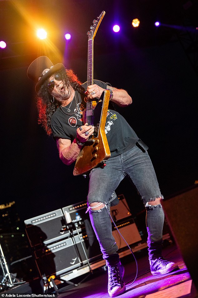 The Paradise City musician completed his ensemble with sunglasses, necklaces and Converse shoes as he took to the stage at the venue.