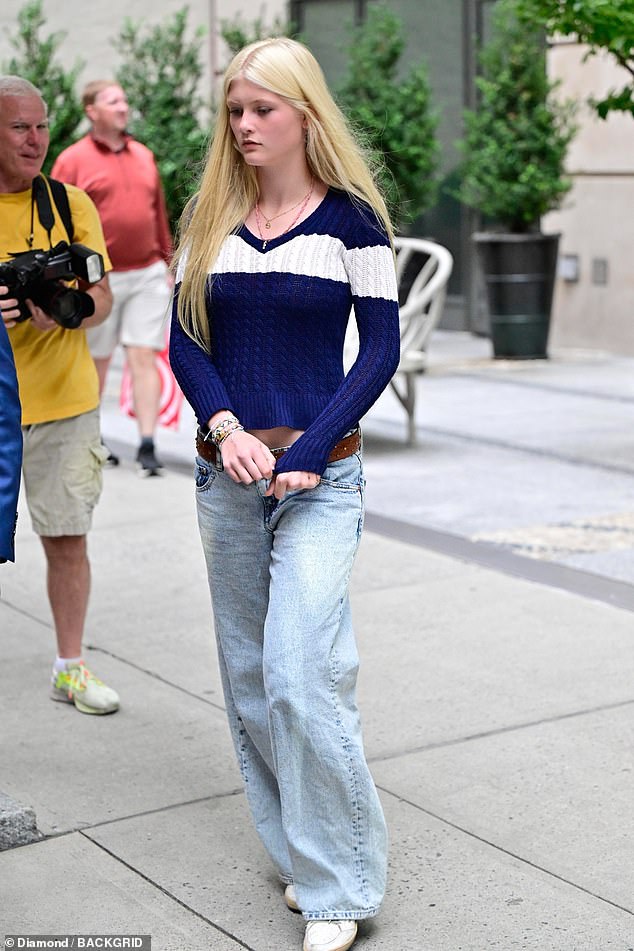 Her youngest daughter, Cosima, 14, also joined in, dressed in a navy sweater, jeans and sneakers.