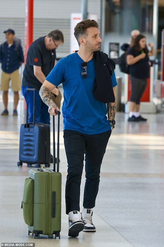 Meanwhile, Tommy opted for a more low-key, casual look as his coworkers and potential lovebirds boarded their plane together.