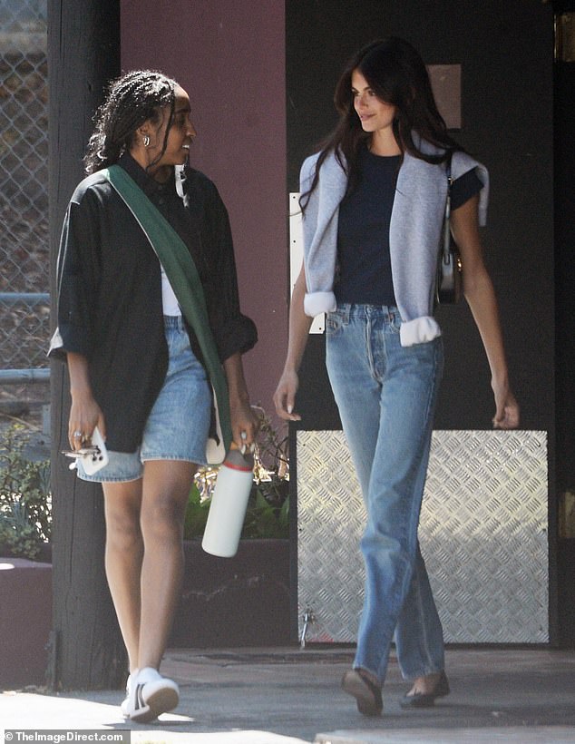 Kaia (right) cut a casual figure in a navy T-shirt and jeans as she met up with The Bear star (left) for a pre-lunch meet-up.