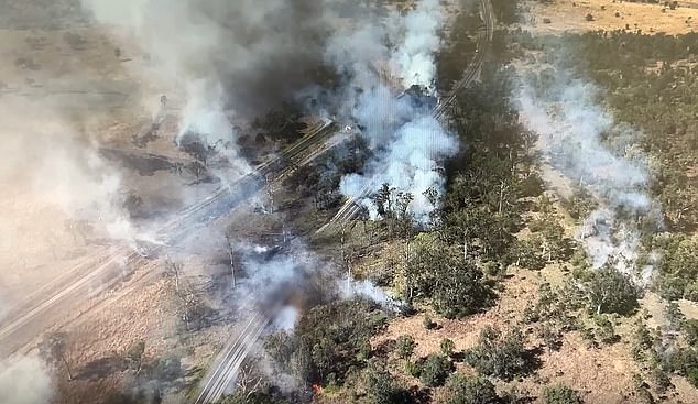 Shocking new footage has shown the extent of the damage (pictured) caused after a massive chemical explosion was caused by a van colliding with a truck on an extremely dangerous road.