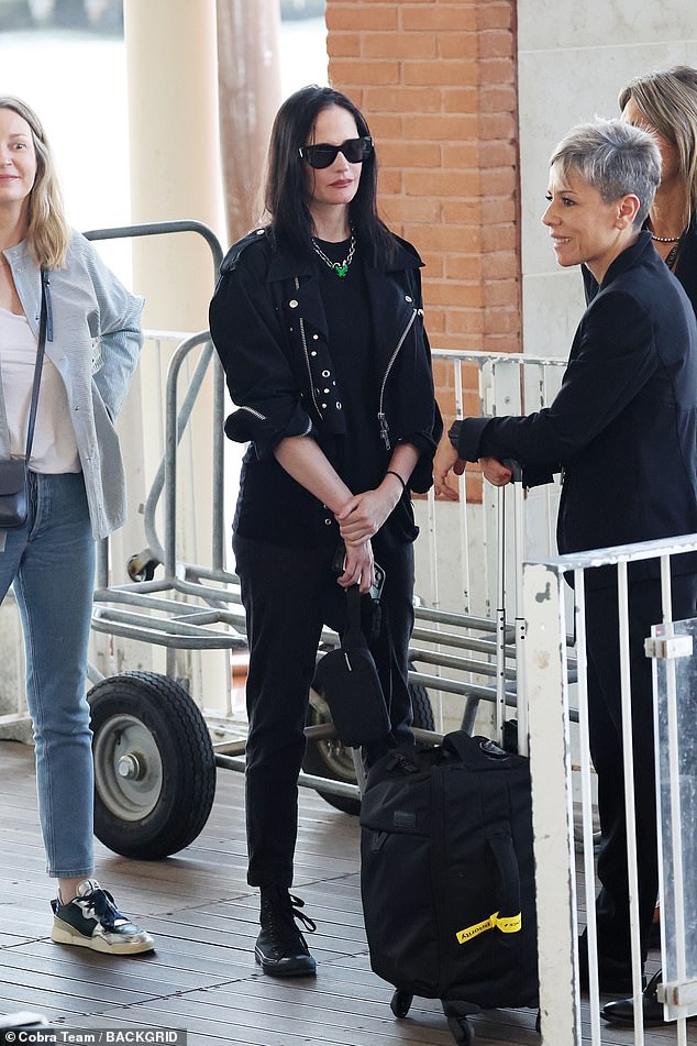 The Casino Royale star opted for an all-black ensemble despite the sunny weather, as she left her black hair unstyled and falling over her shoulders.