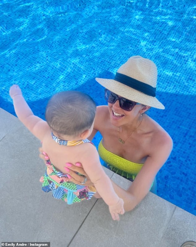 And it looks like the family had a blast, with Emily looking on cloud nine as she enjoyed a dip in the pool with Arabella on Tuesday.