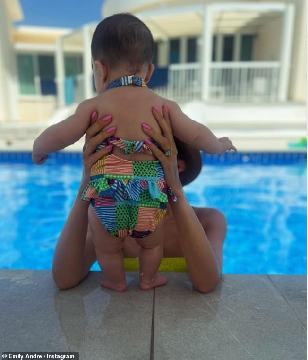 Arabella was dressed in a multi-colored swimsuit as Emily enjoyed spending quality time with her on their trip.