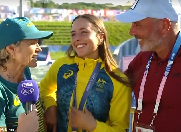 Proud parents Myriam Fox-Jerusalmi and Richard Fox are pictured celebrating with Noemie after her stunning kayak cross win in Paris