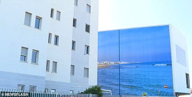 The image shows the giant canvas that replaces the sea view in Torrevieja, Spain