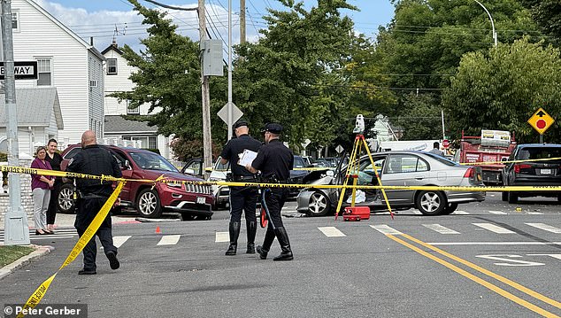 Police inspect the scene of the accident where Noel died