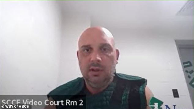 At his first hearing on Friday, he appeared before Judge Michael J. Silvanio via video link, where he was seen dressed in a green prison vest with Velcro shoulders.